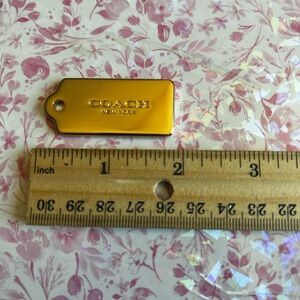 Coach Gold Metal Tag with Embossed Logo